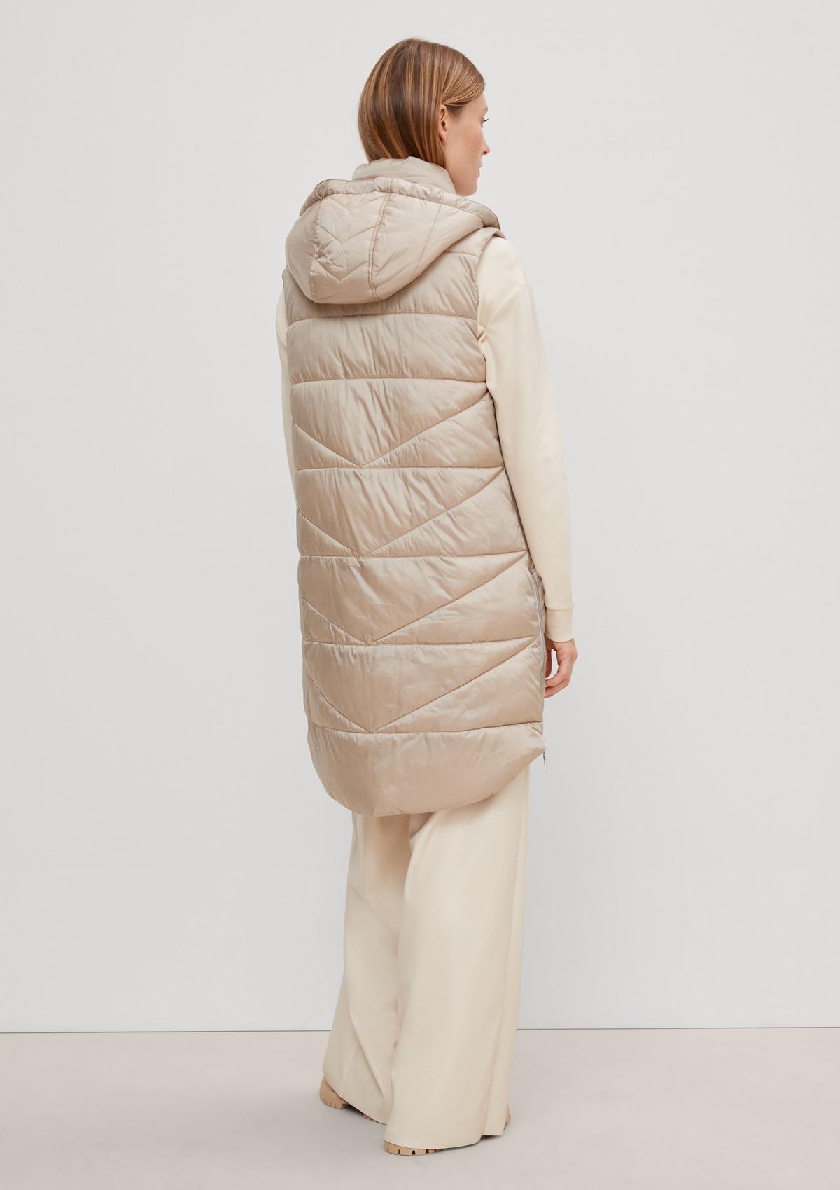 Long quilted body warmer with a hood - beige