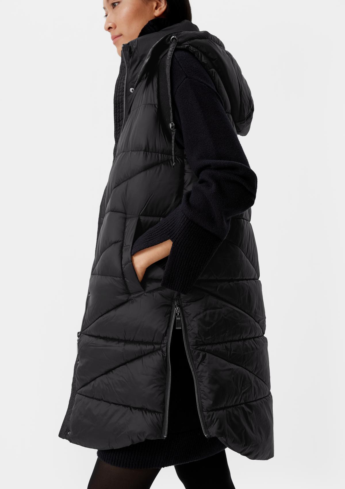 comma Long quilted body warmer with a hood