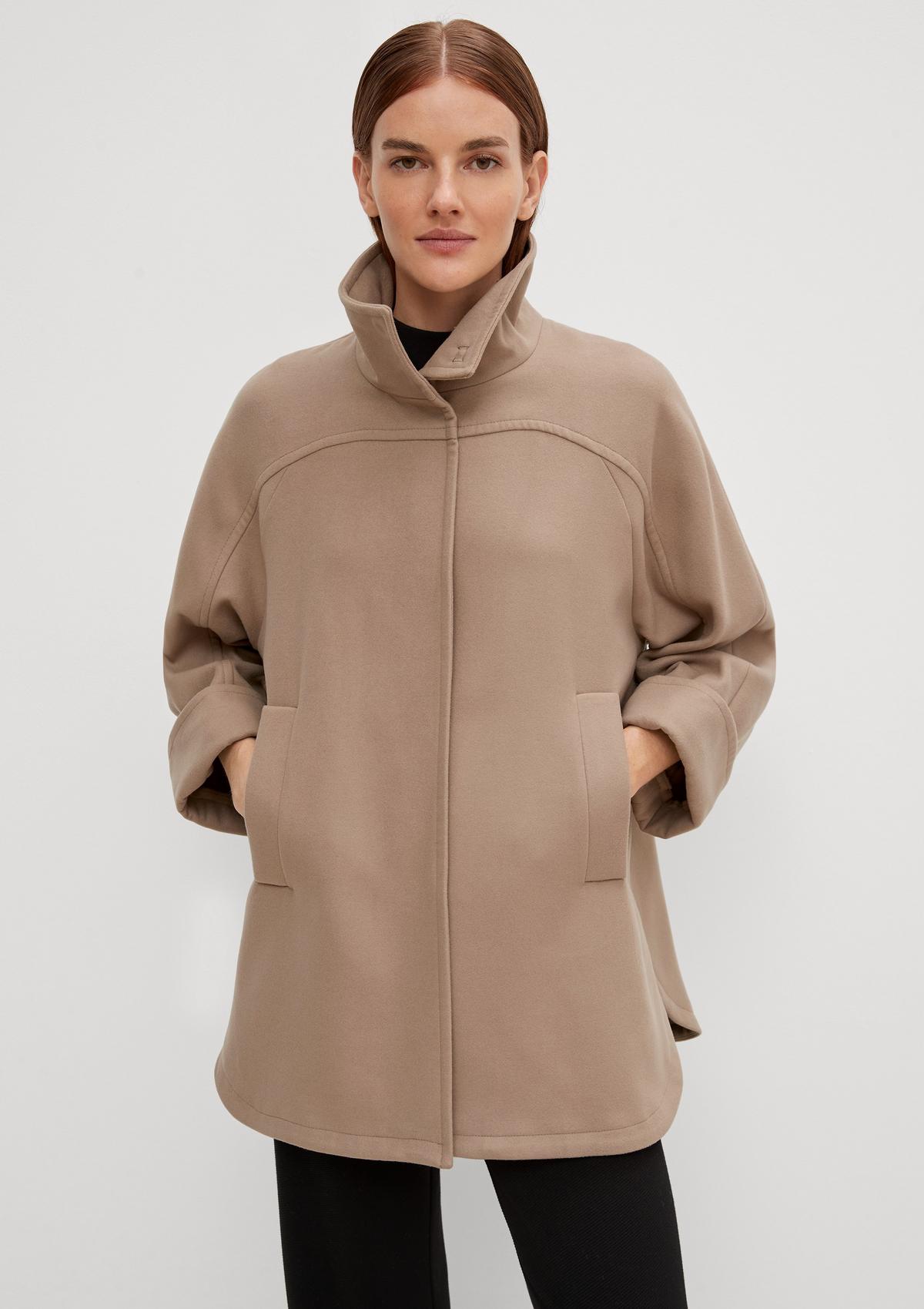 comma Cape-style coat