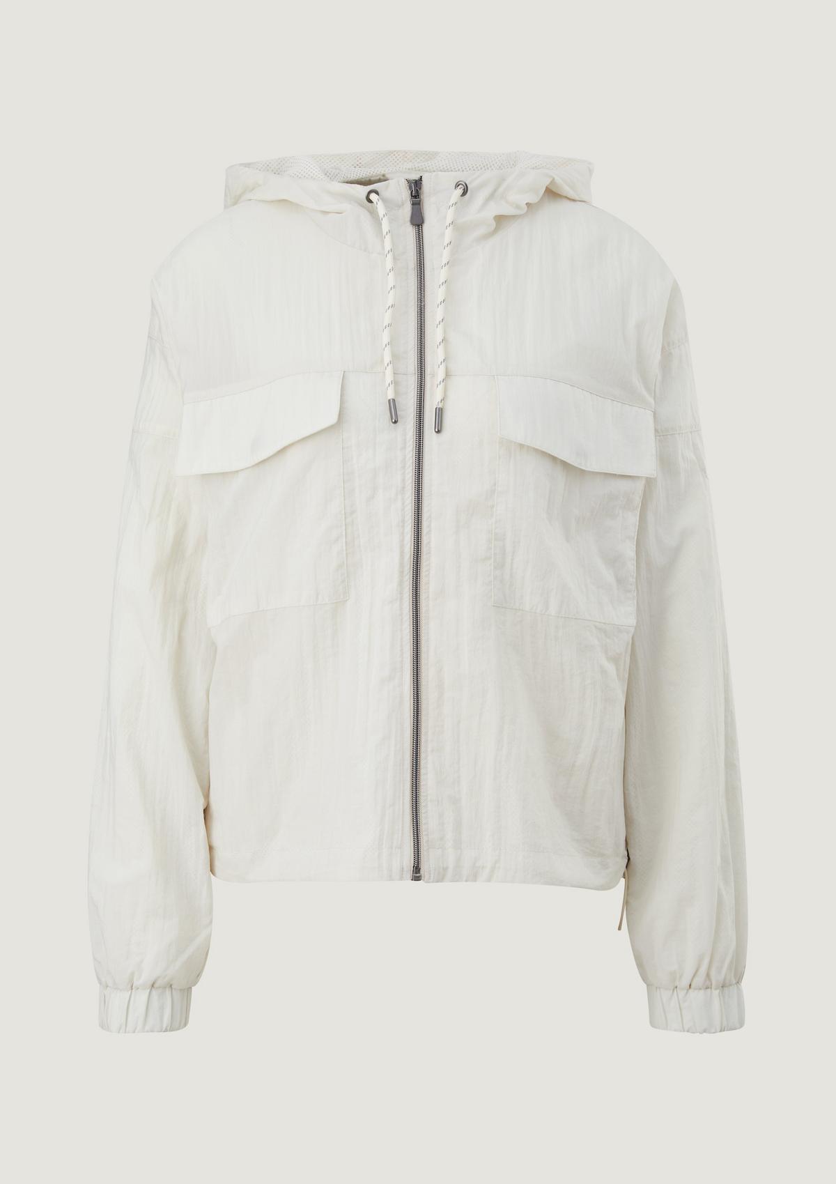 comma Nylon jacket with a pouch pocket