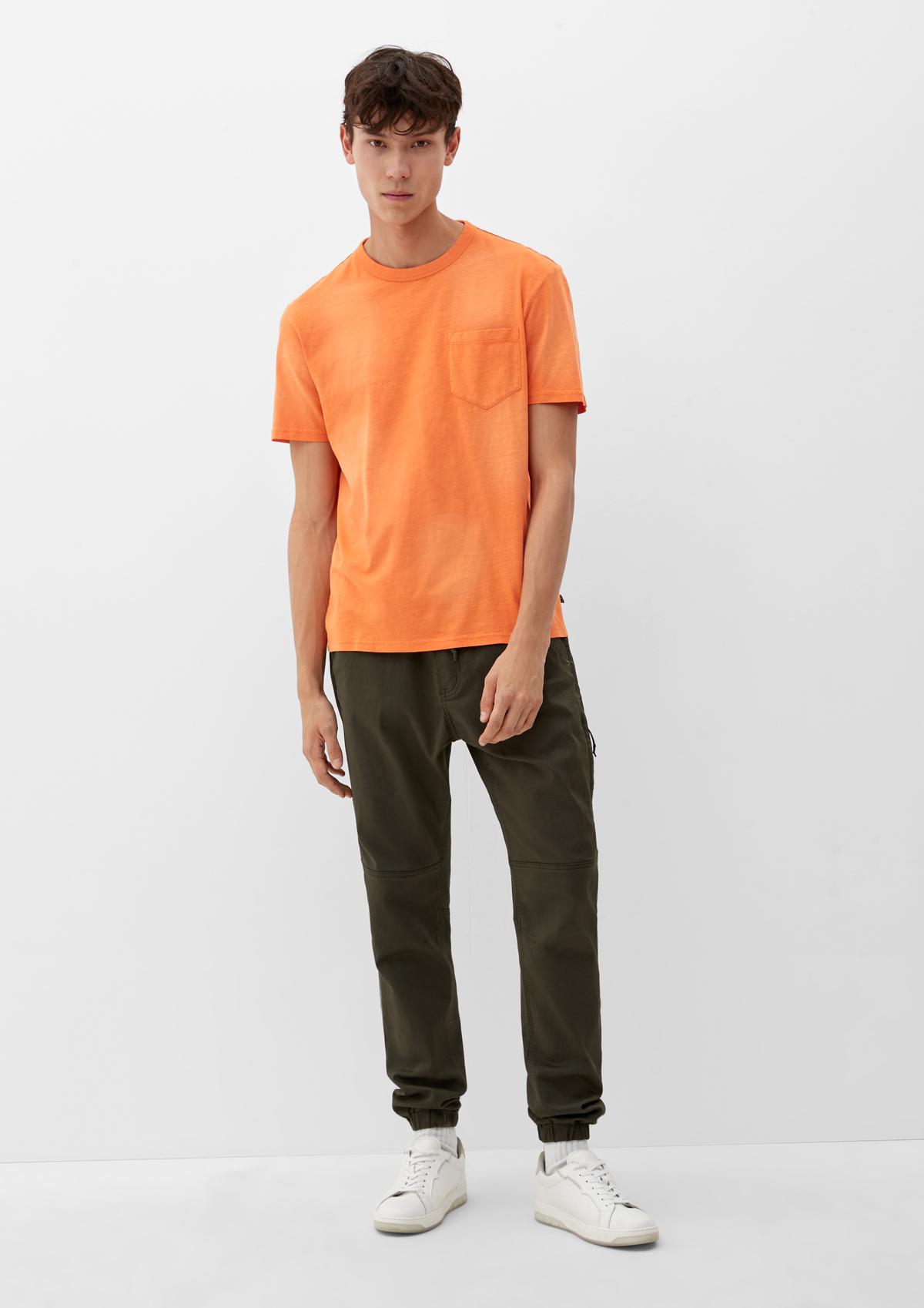 breast with orange - a T-shirt pocket