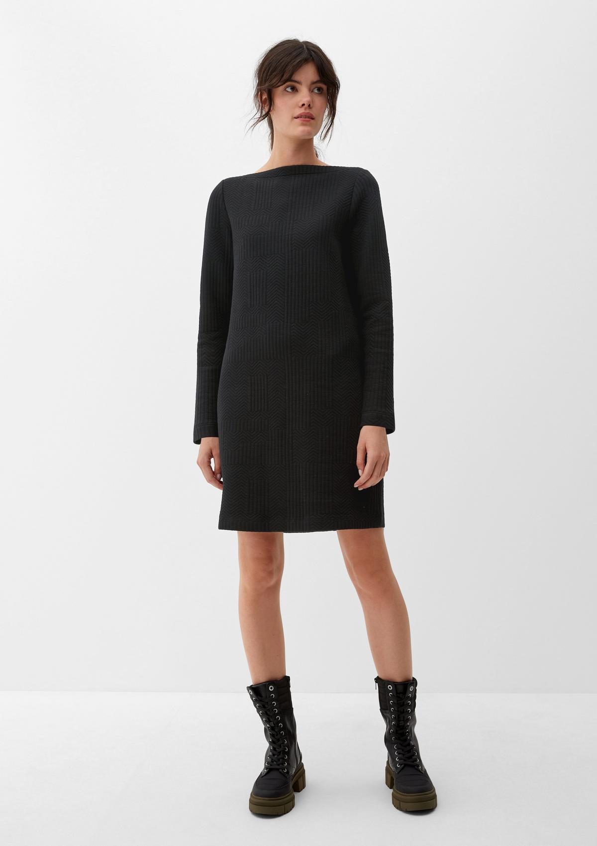Black Cocoon Pocket dress, Ankle Boots and Printed Tights - What