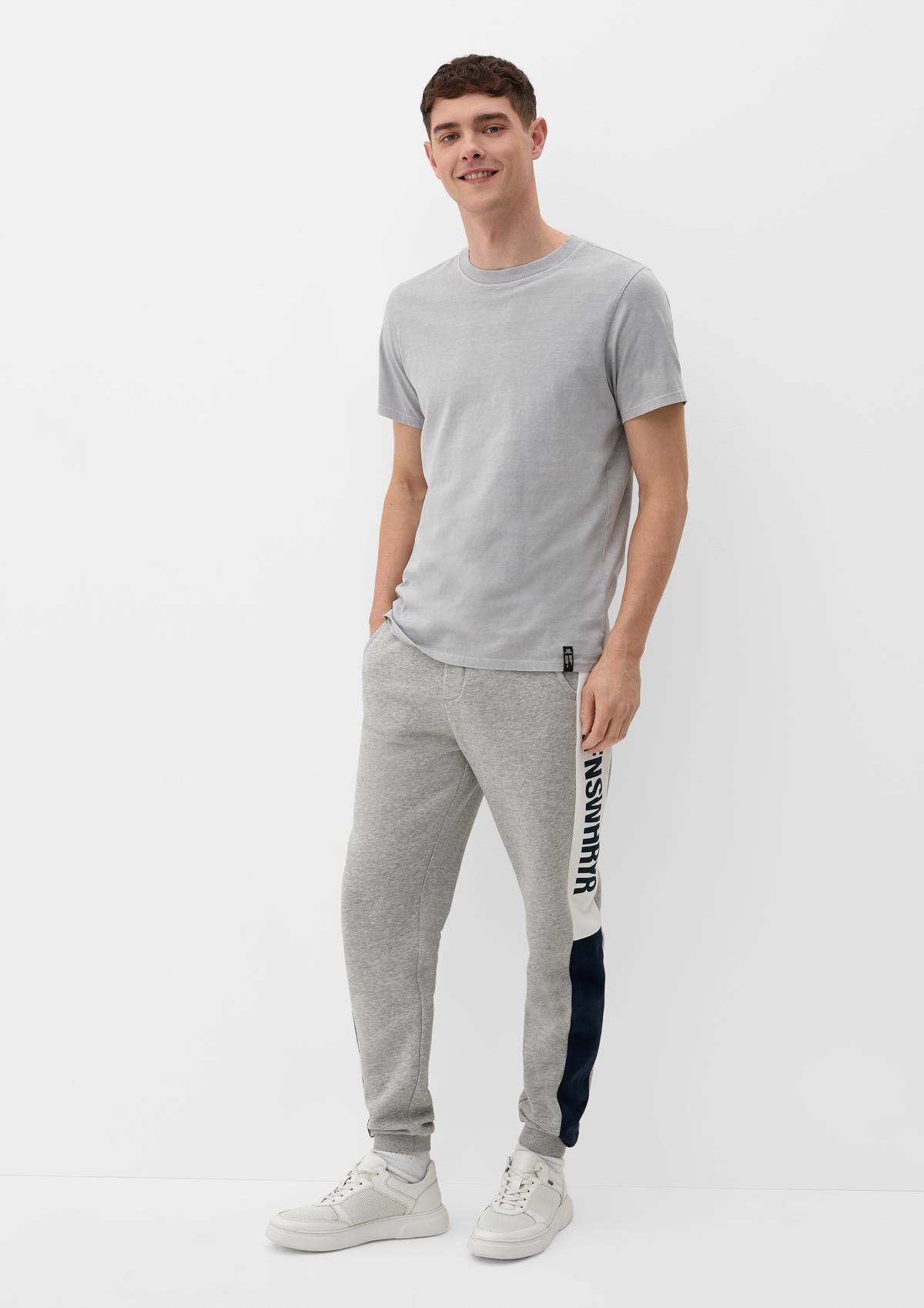Slim fit: tracksuit bottoms with lettering on the side