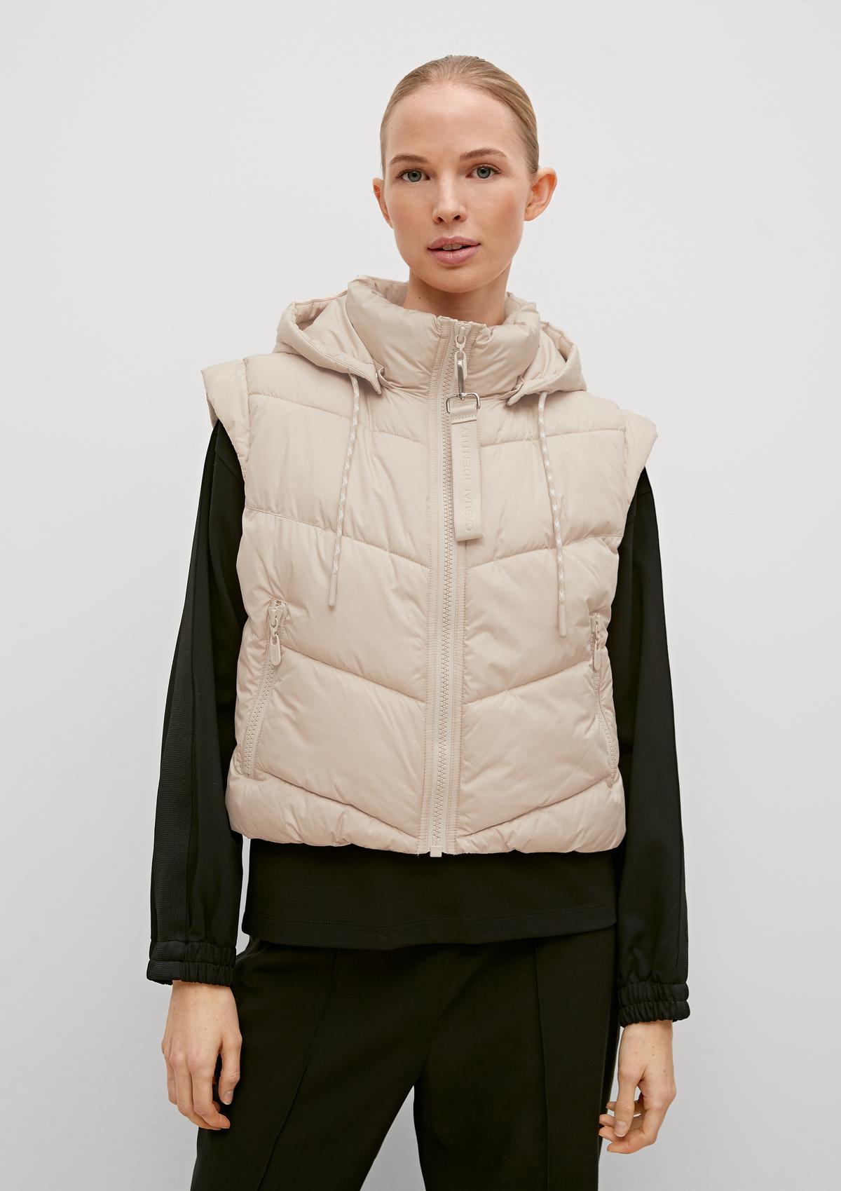 Quilted body warmer with a detachable hood