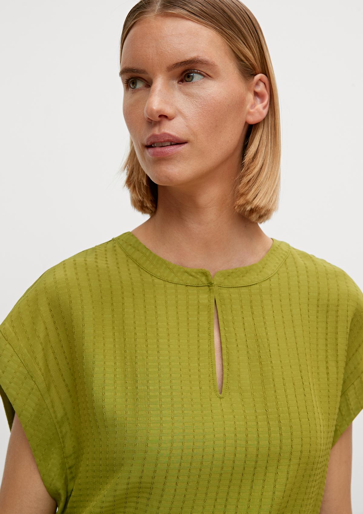 comma Sleeveless blouse with a notch neckline