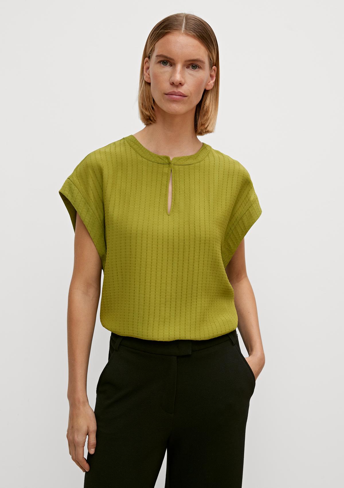 comma Sleeveless blouse with a notch neckline