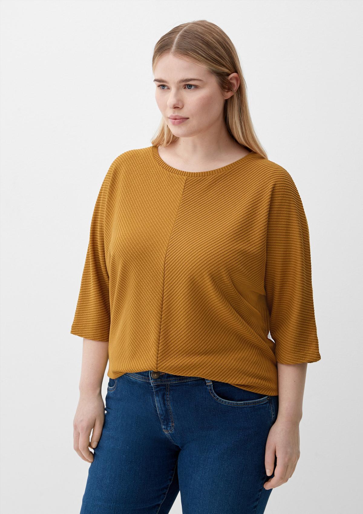 Top with batwing sleeves