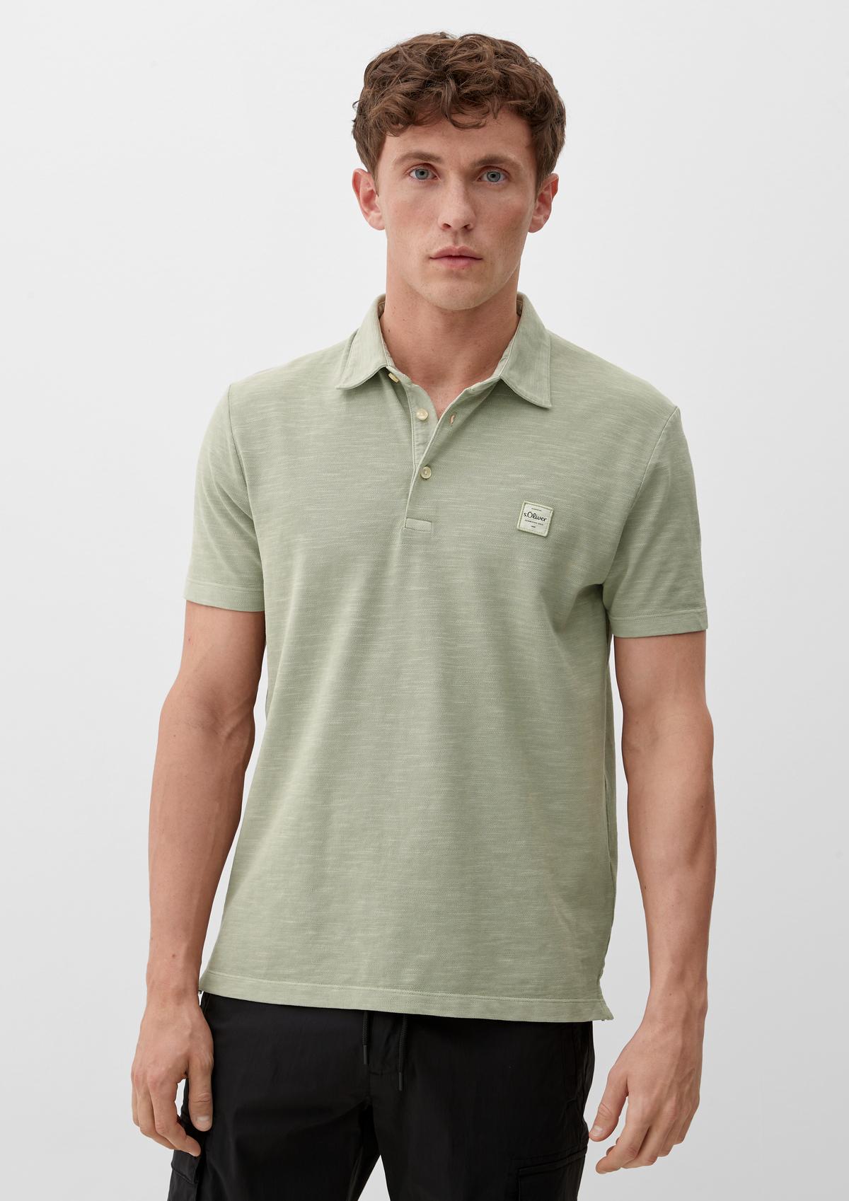Polo shirt with a logo appliqué