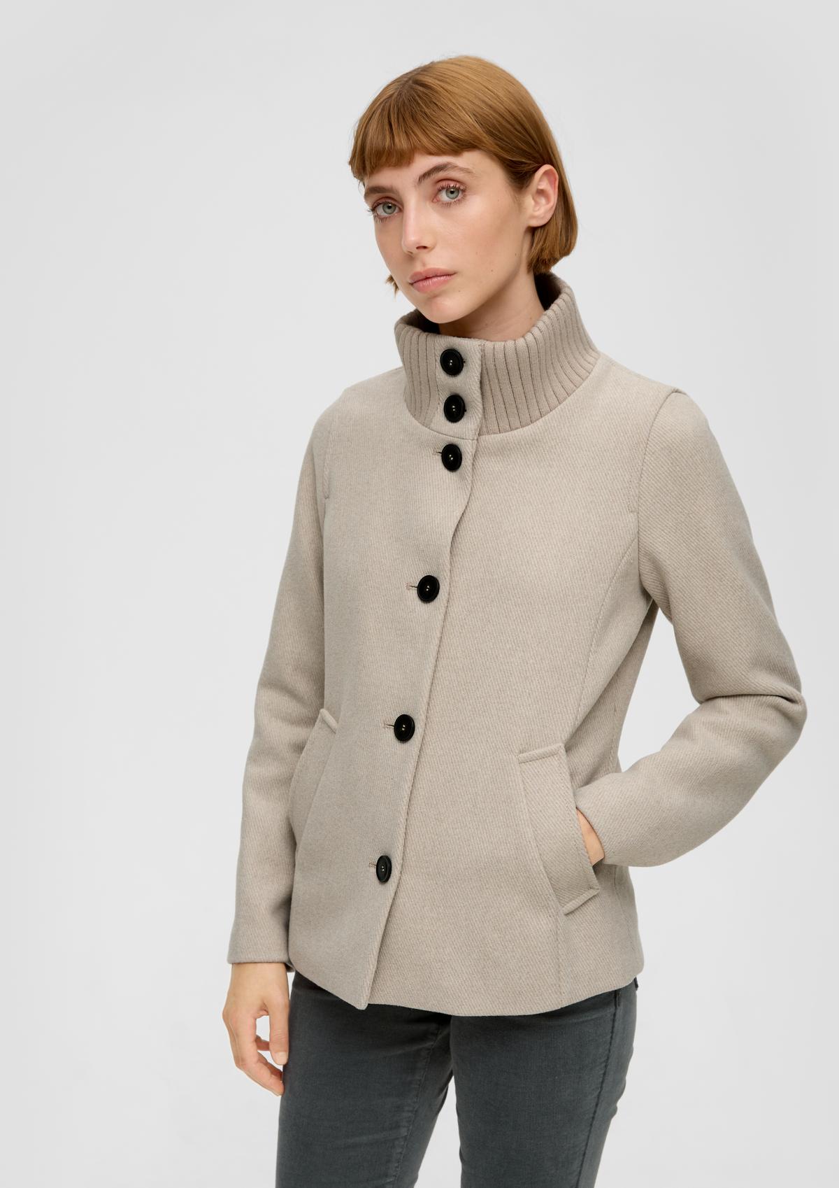 Jacket with a rib knit stand-up collar