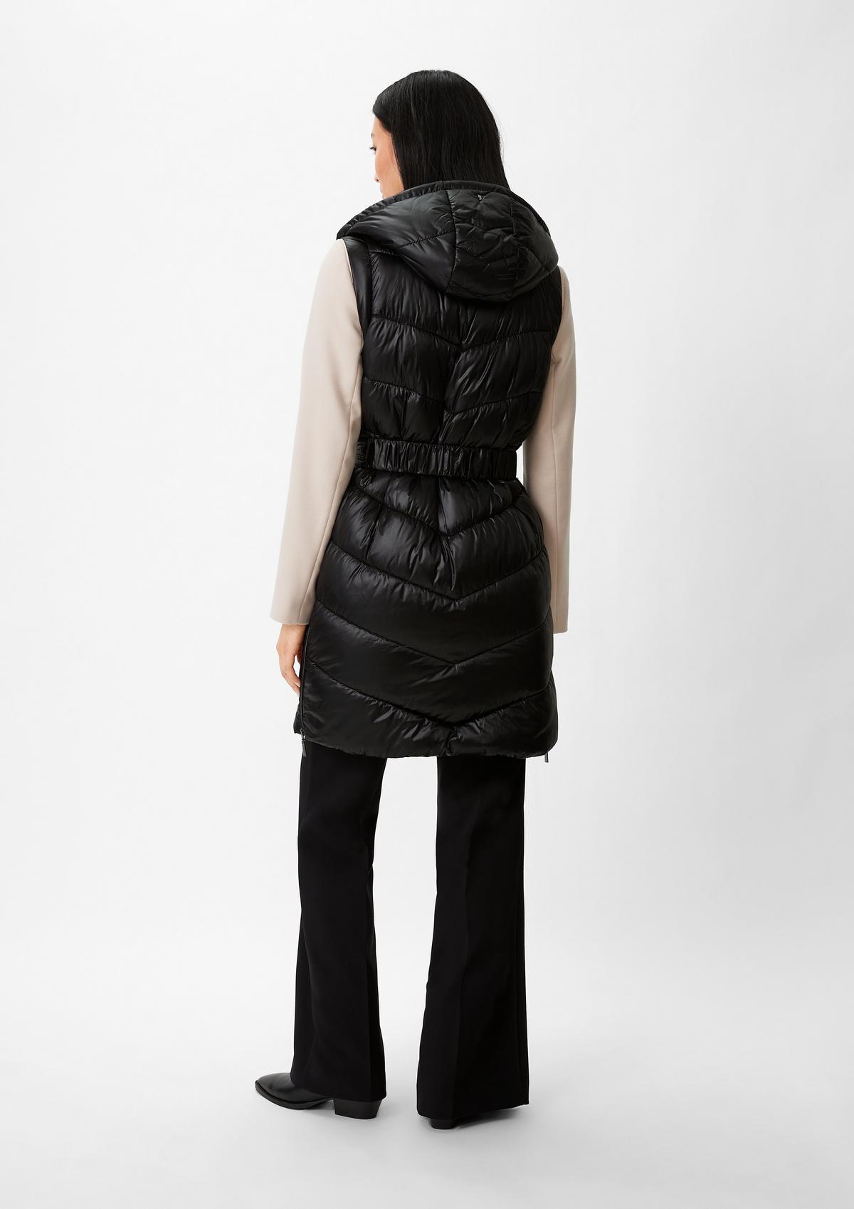 comma Long quilted body warmer with a cinch belt