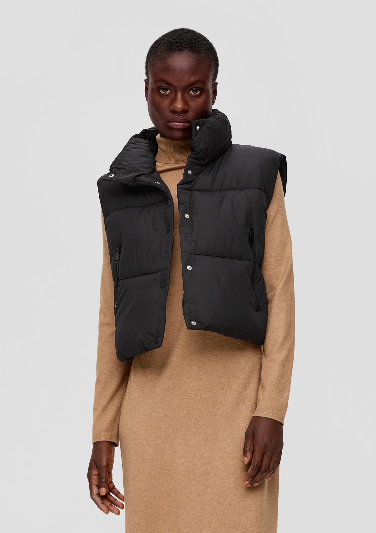 Padded quilted body warmer with a stand-up collar