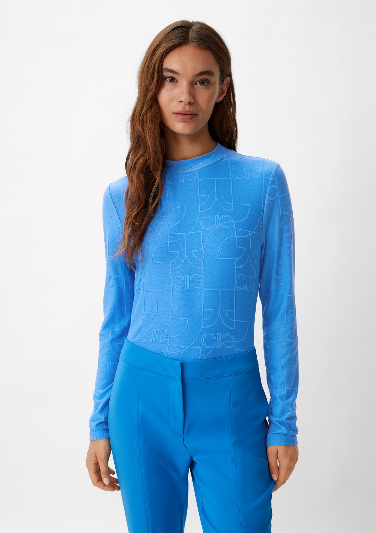 Long sleeve top with a logo pattern