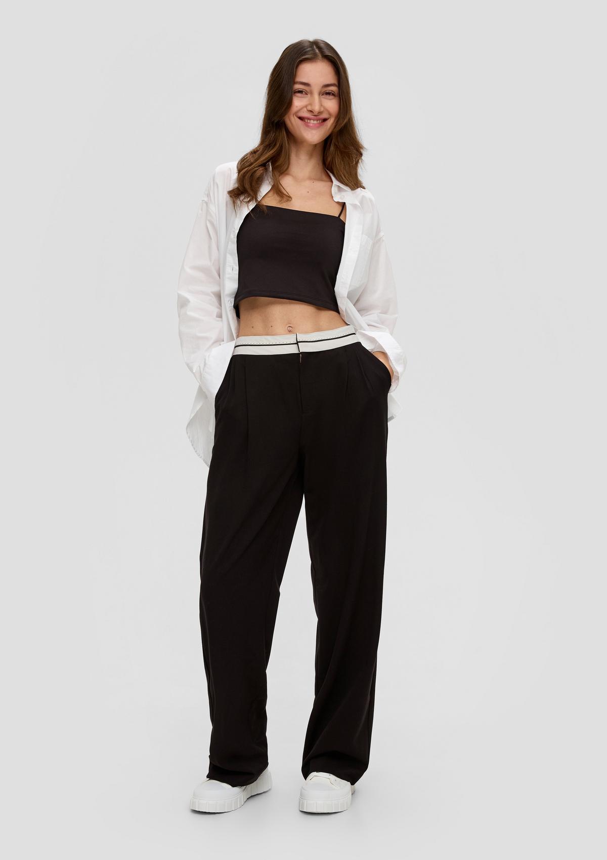 Trousers with waistband with a turn-back look