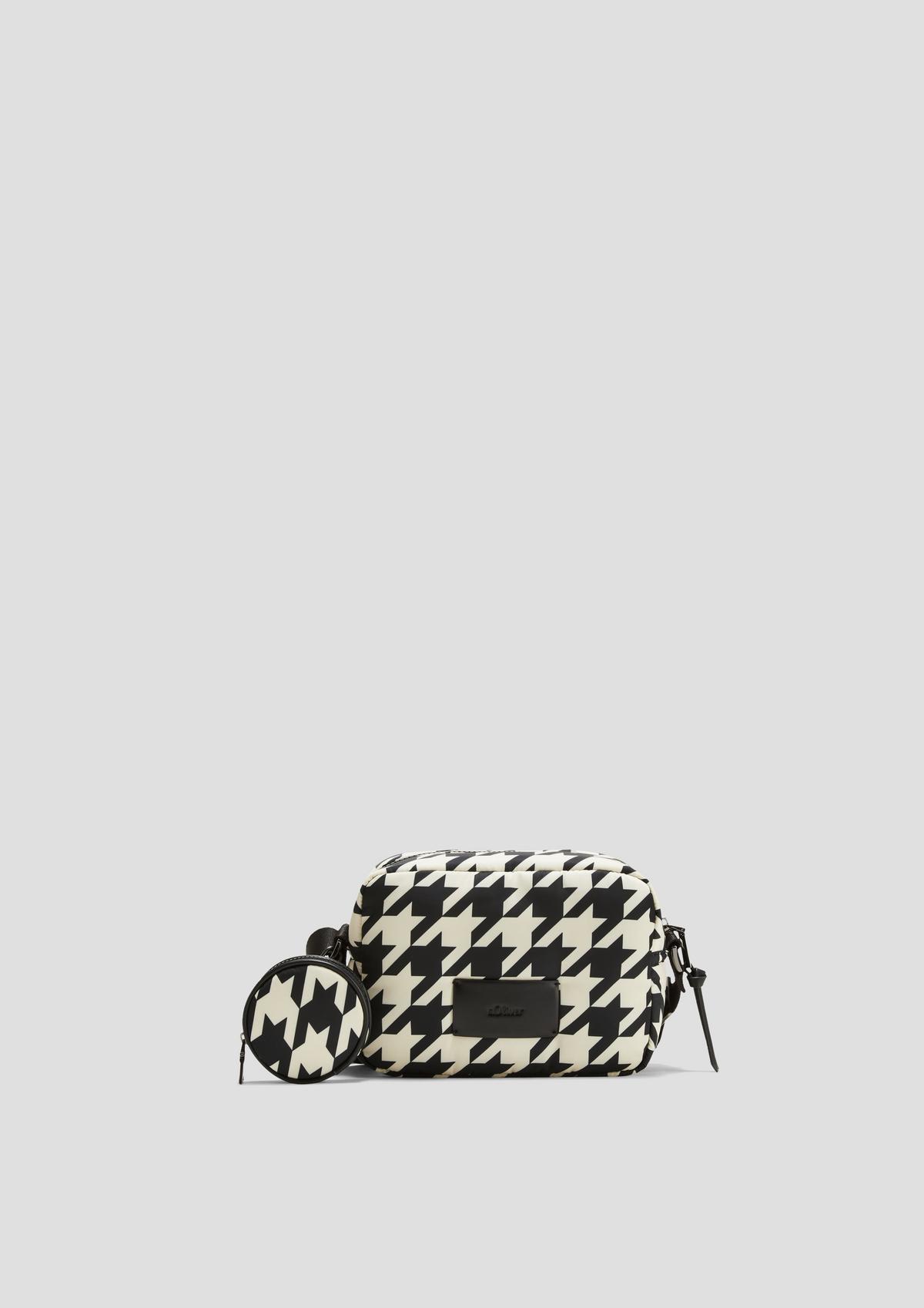 Cross-body bag with a houndstooth pattern