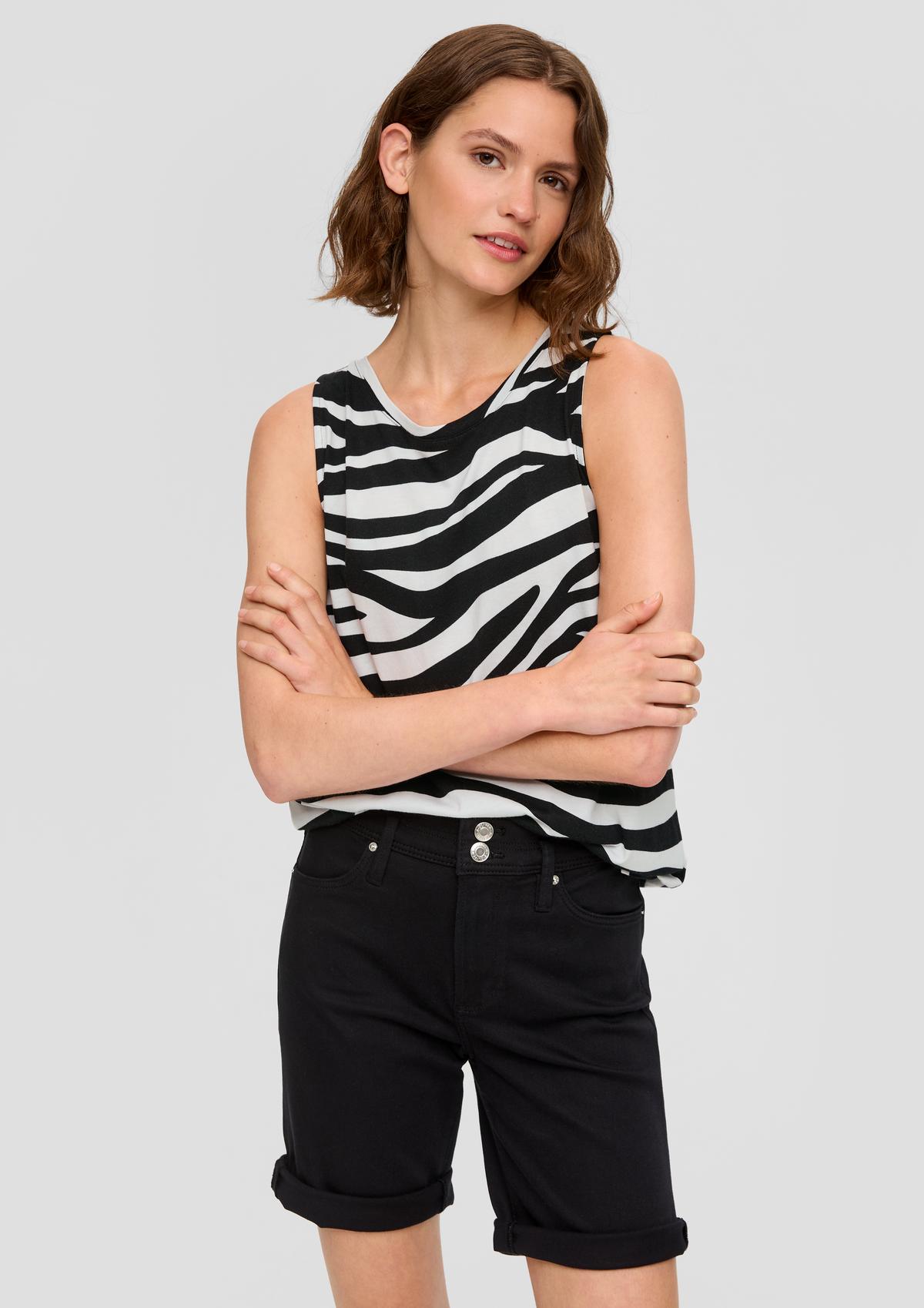 Sleeveless top with a round neckline and tie detail on the back