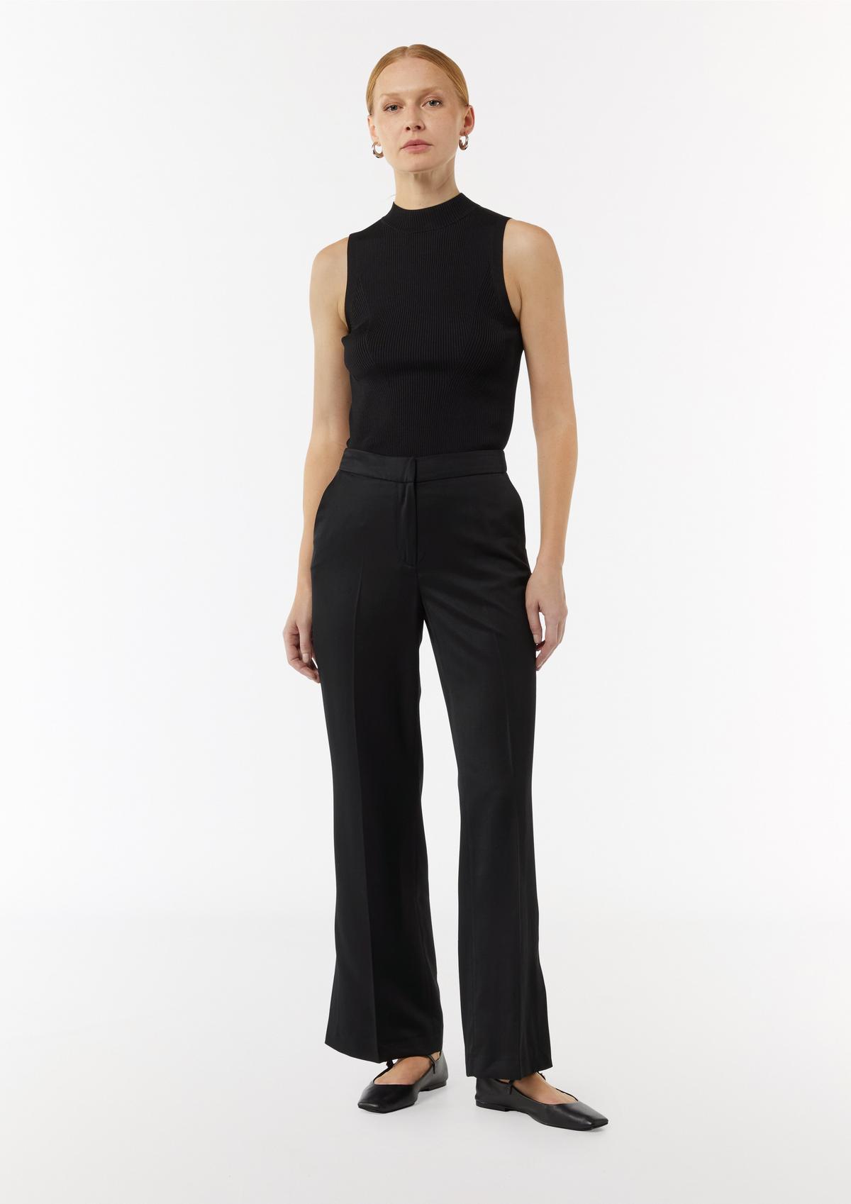 Trousers with a flared leg, a subtle sheen and slit details