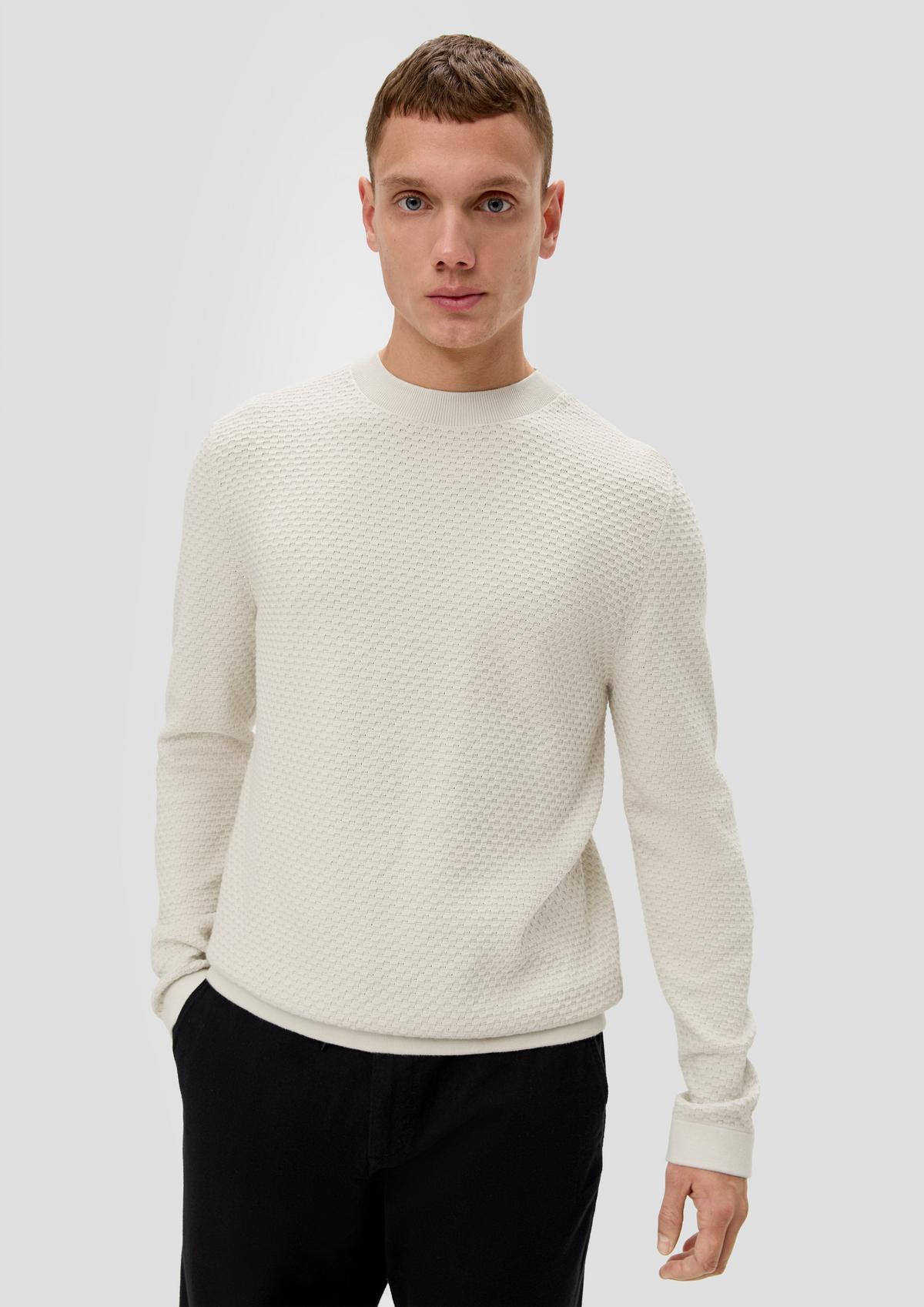 Knitted jumper with a garment wash