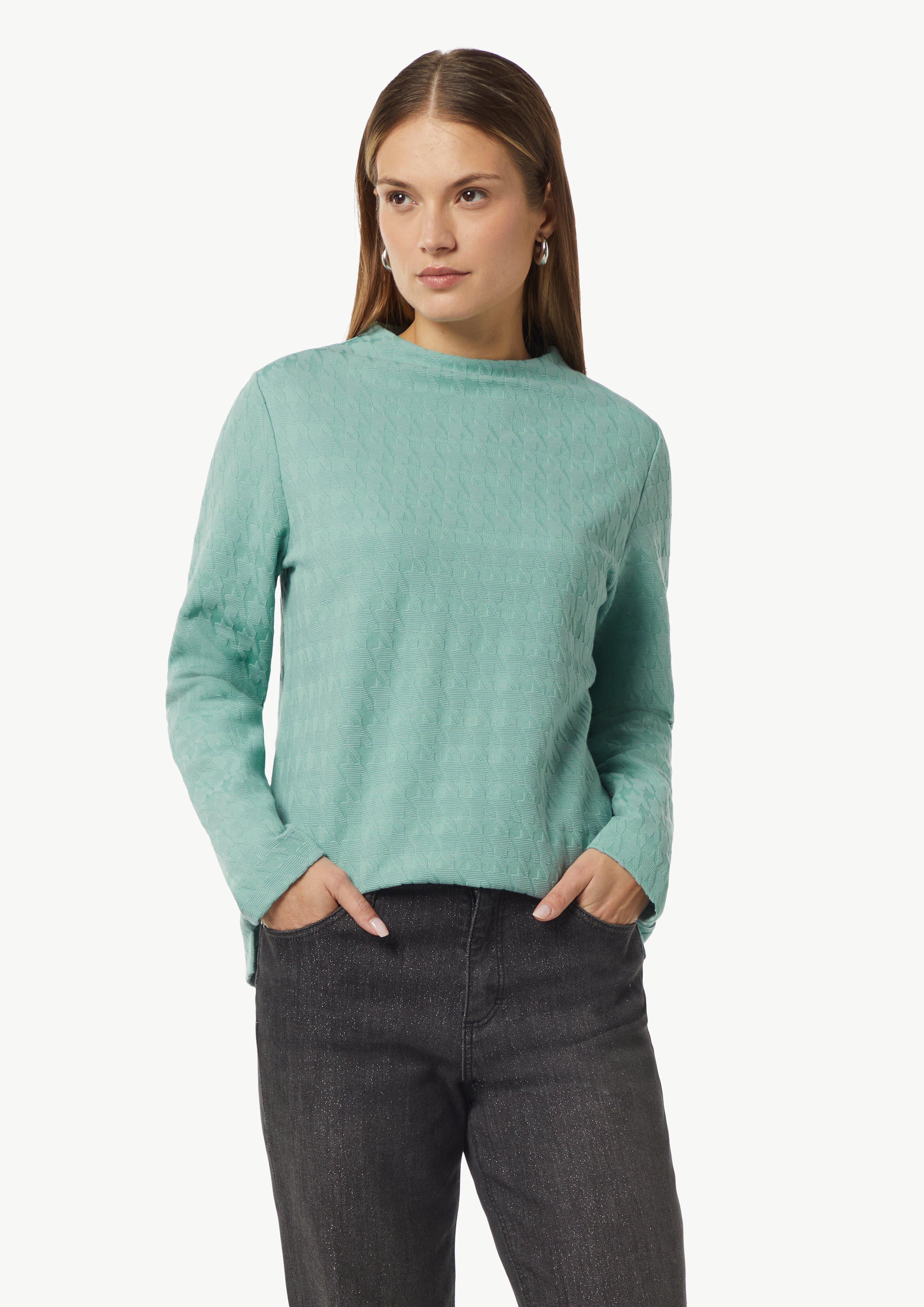 Jersey top with a houndstooth pattern and a stand-up collar