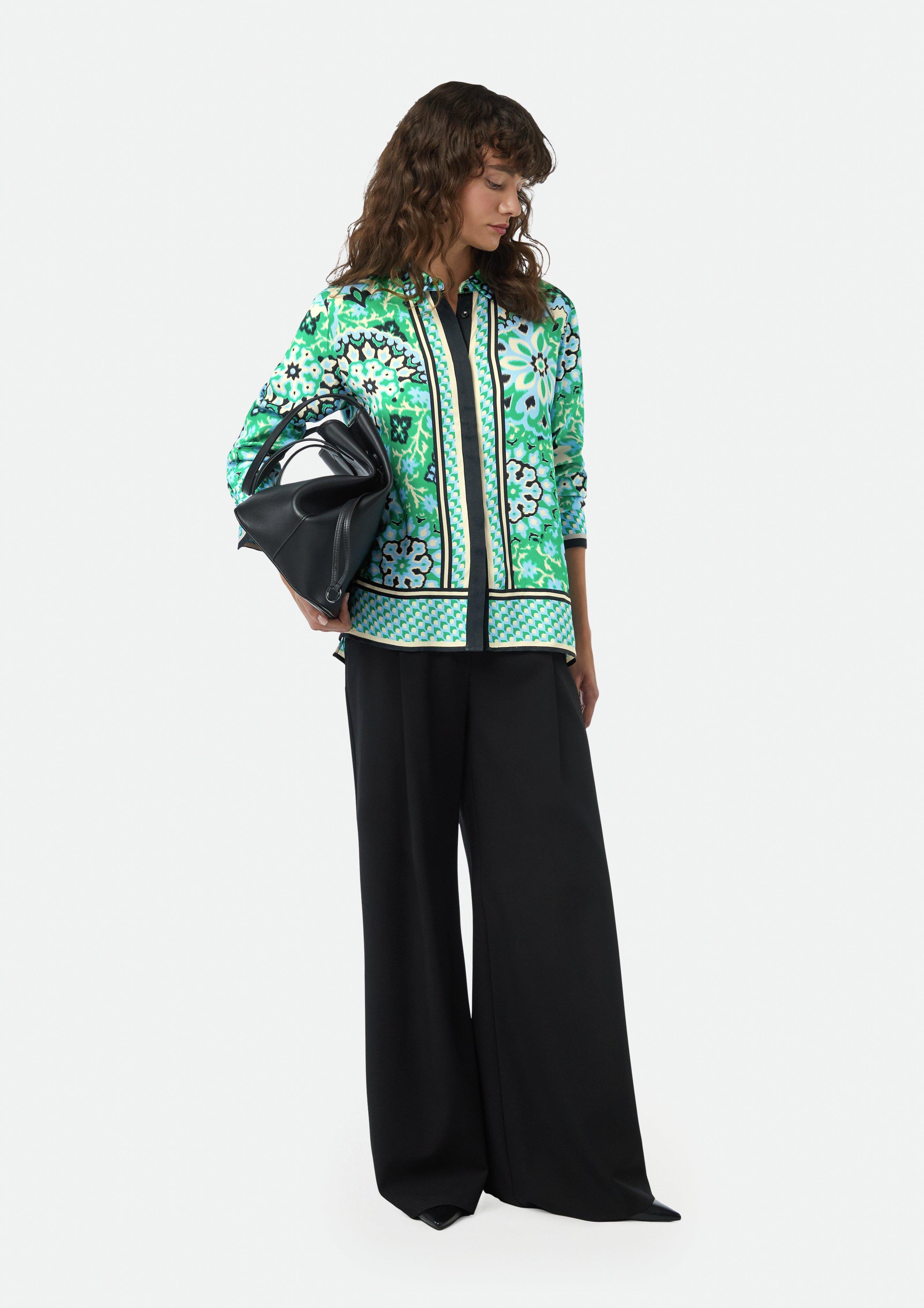 Flowing shirt blouse with concealed button placket and an Flowing shirt blouse with concealed button placket and an