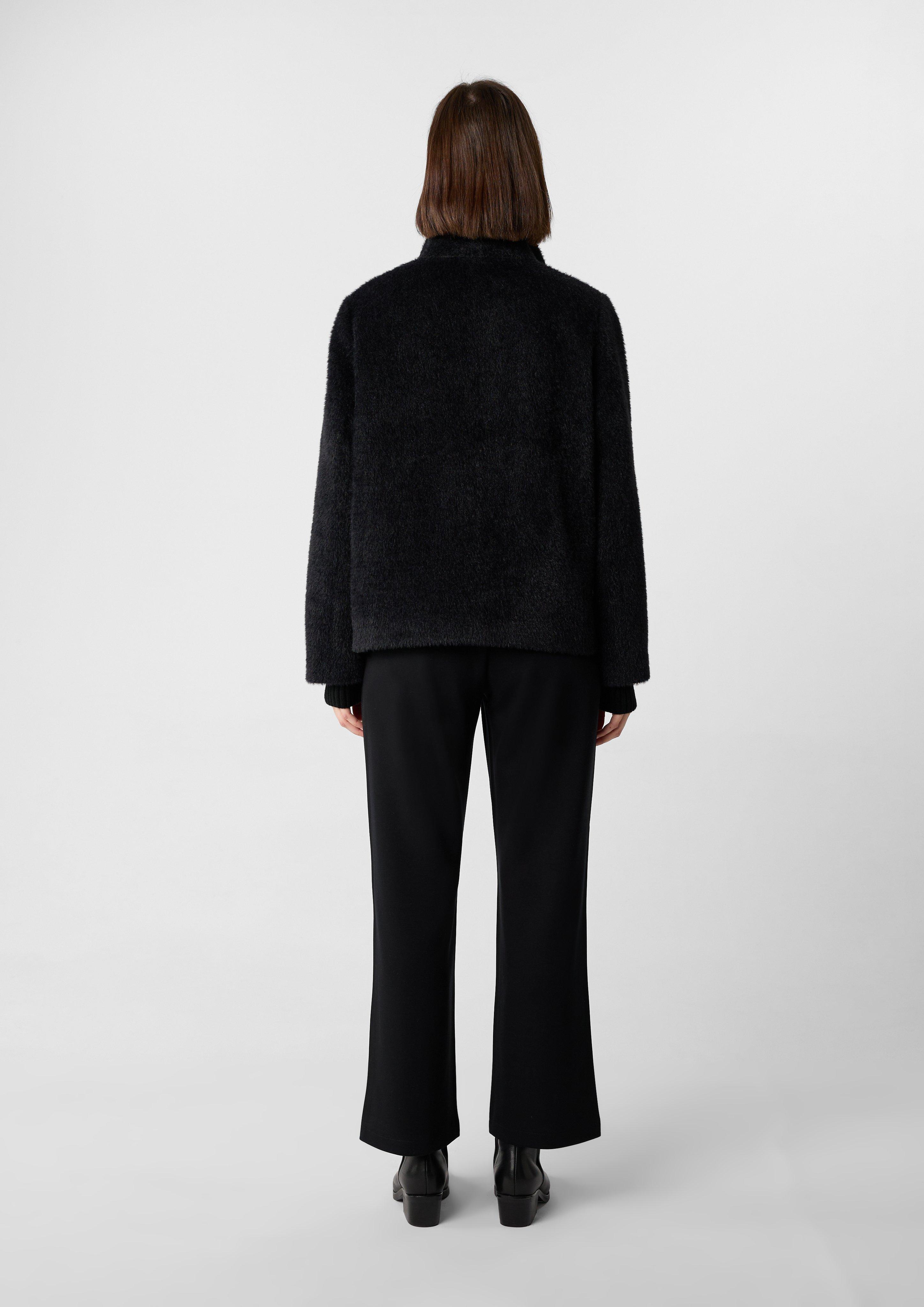 Soft, long-pile cape-style jacket with concealed button