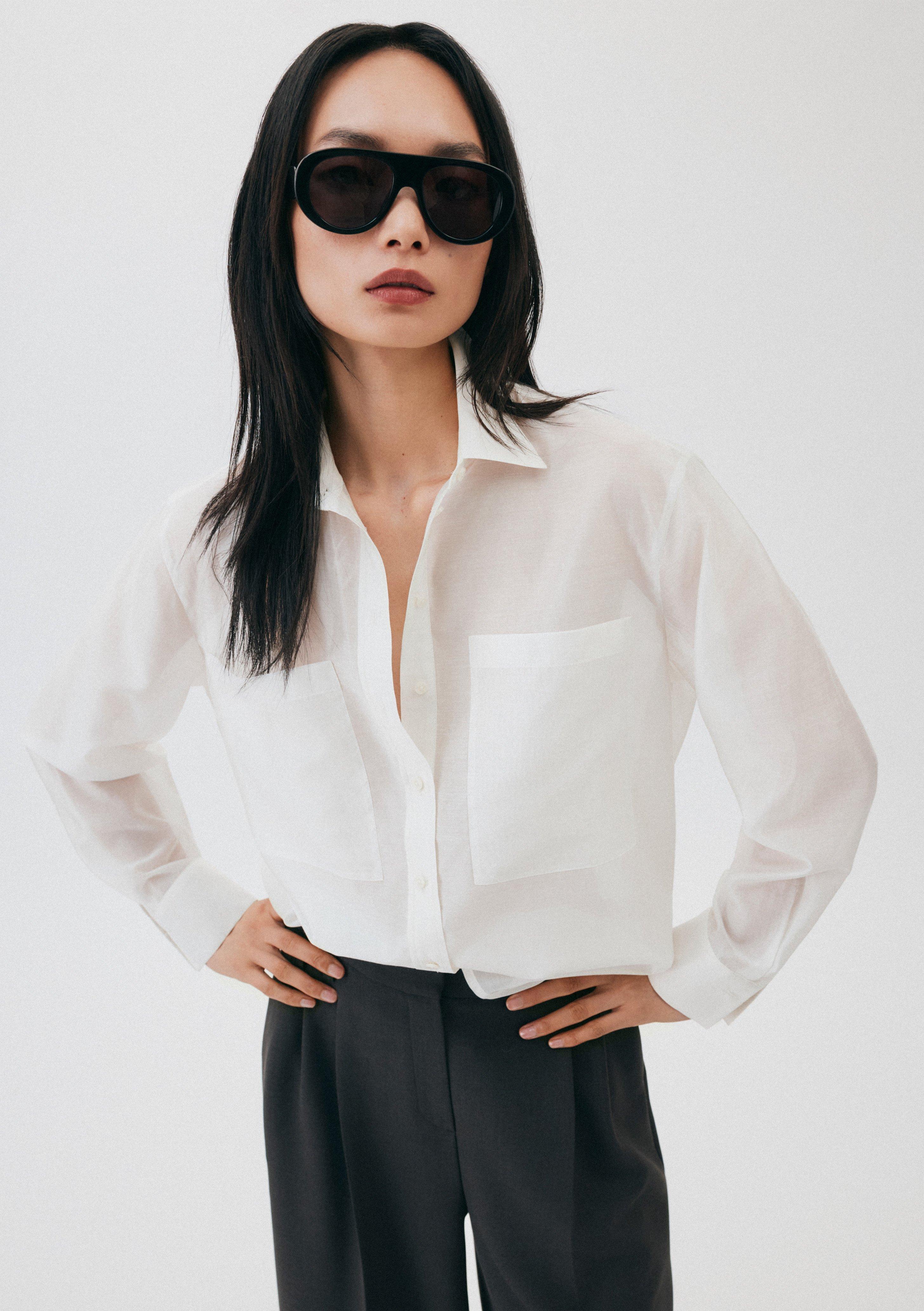 Chemisier en organza transparent avec poches plaquées en crème de COMMA