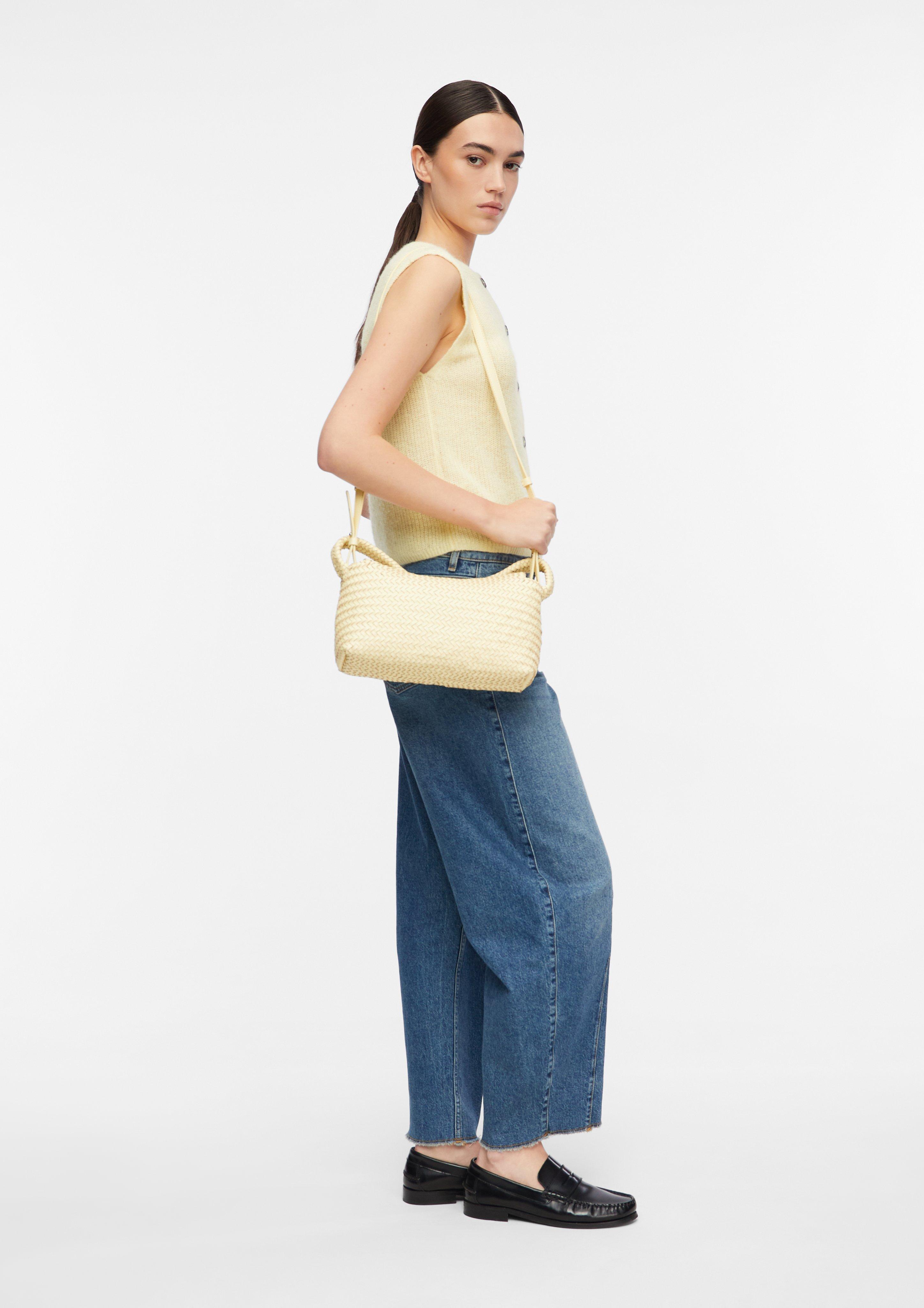 Crossbody bag in braided leather in yellow by COMMA