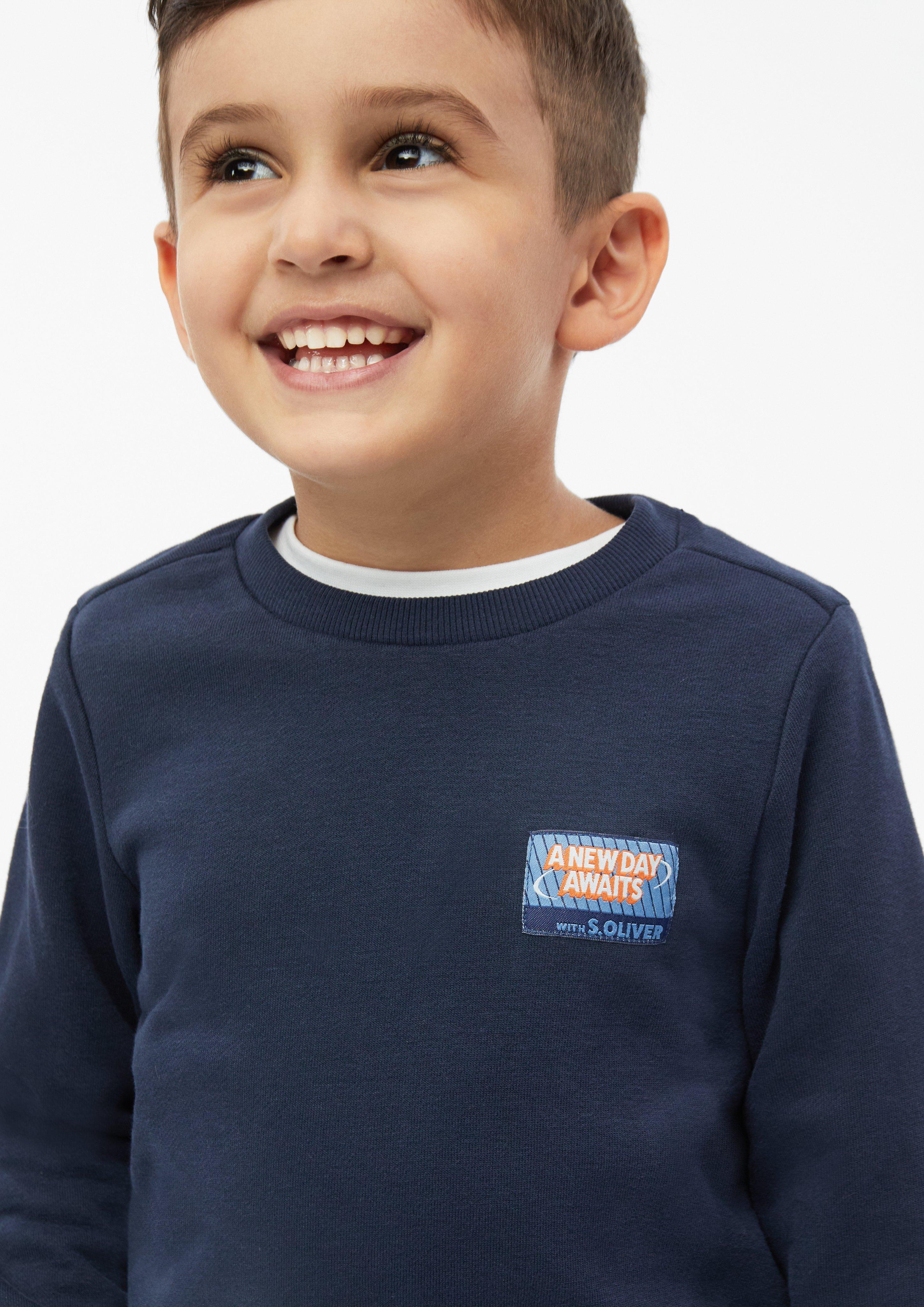 Junior Sweatshirt met patch en print op de rug in blauw van s.Oliver