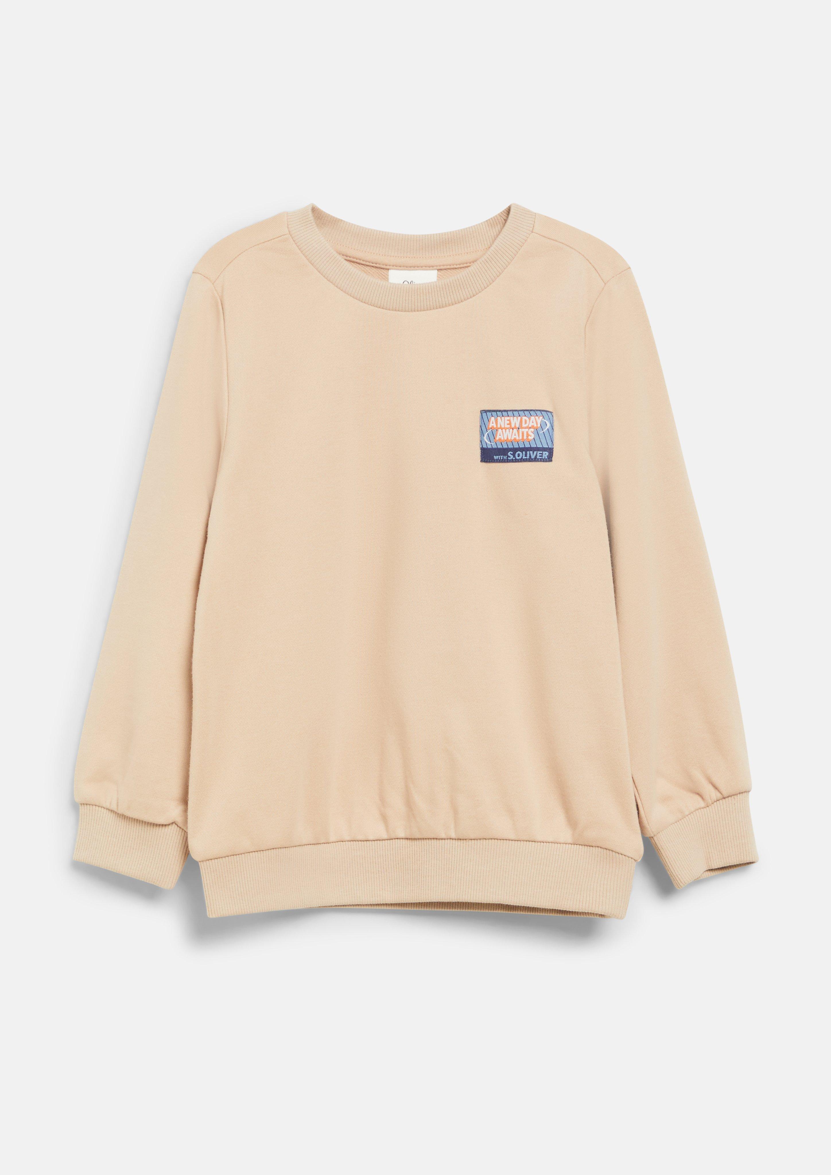 Junior Sweat-shirt avec écusson et imprimé dans le dos en beige de s.Oliver