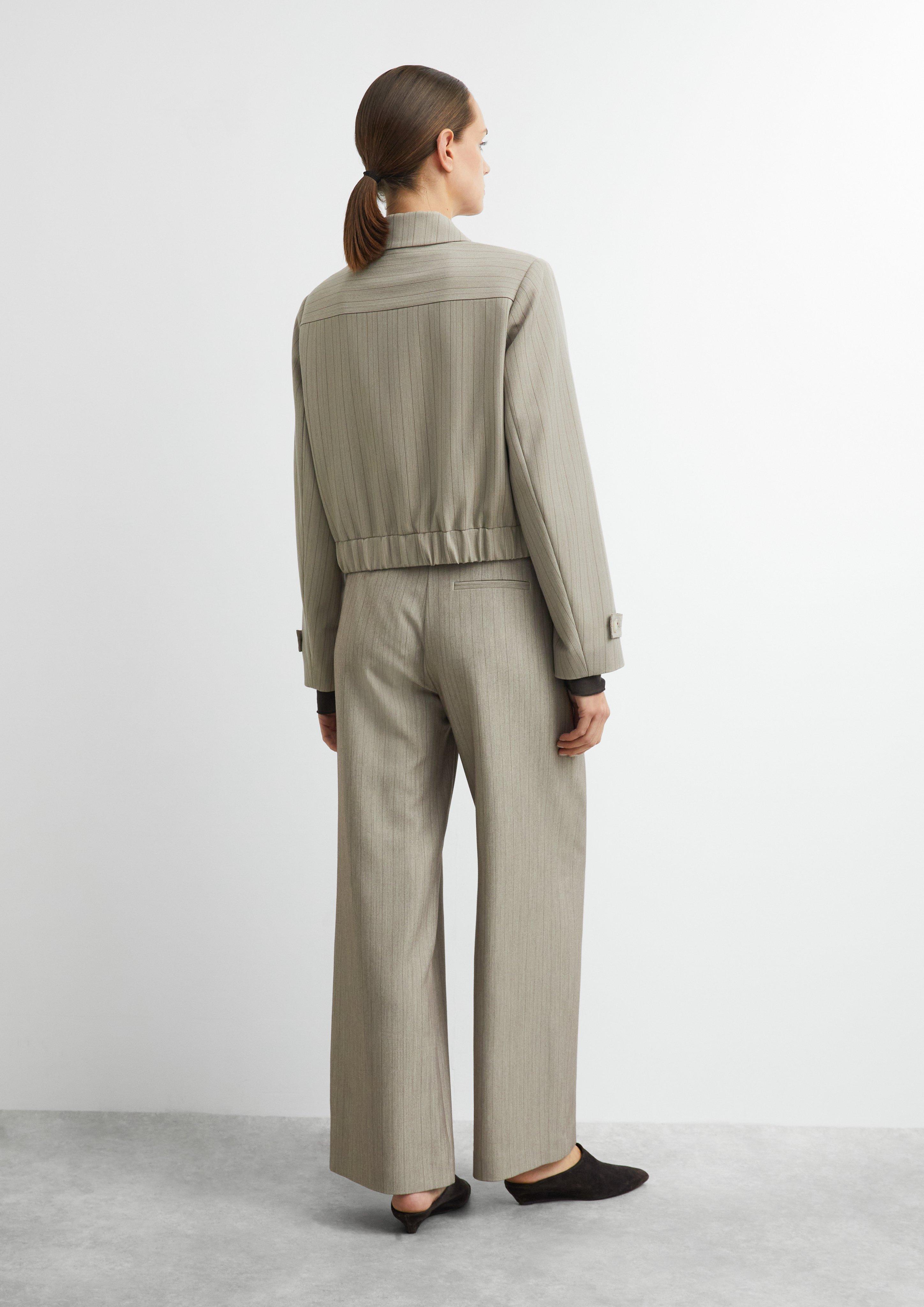 Wide-Leg-Hose mit Faltendetail und Gürtel in beige von COMMA