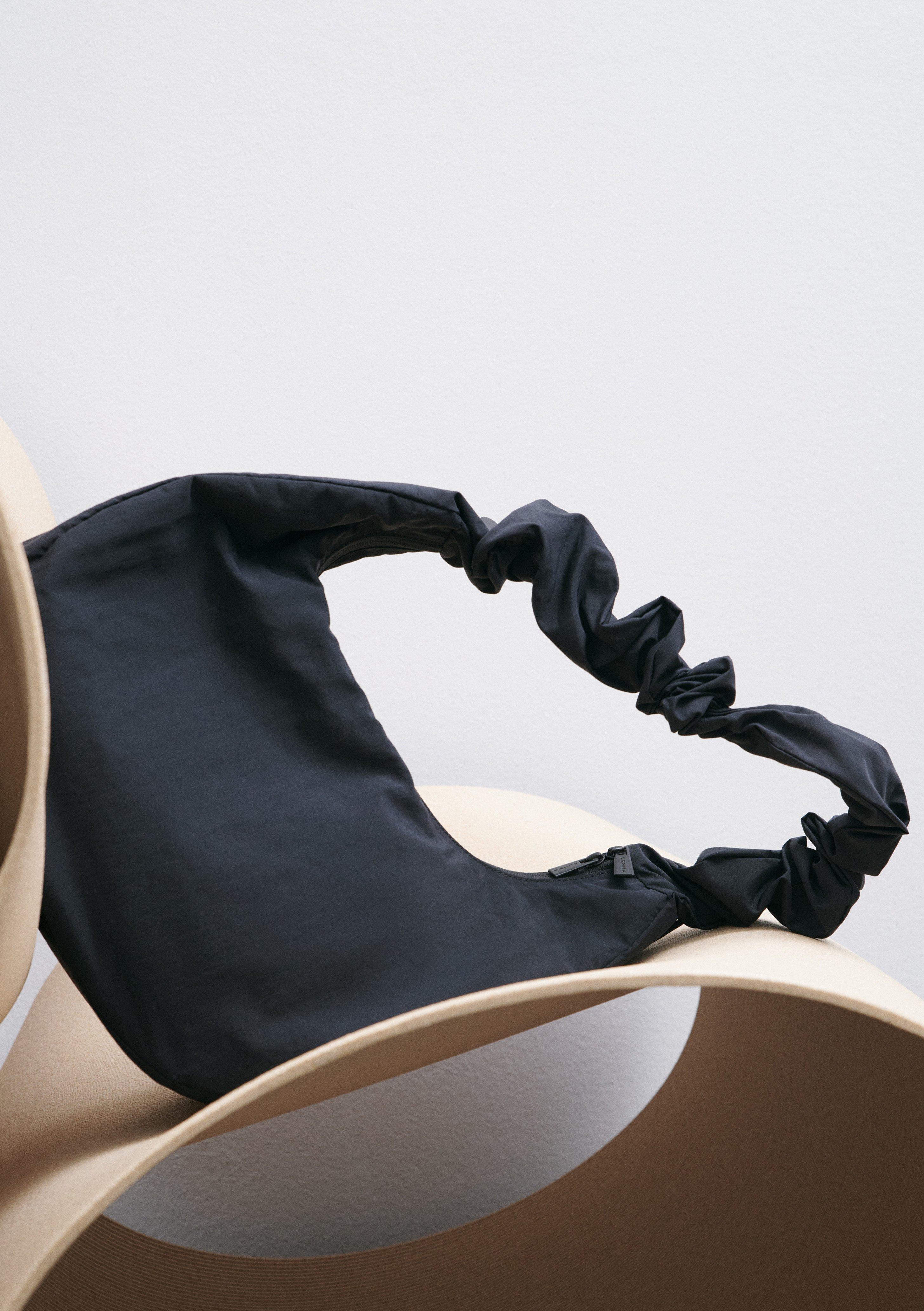 Hobo Bag with an adjustable shoulder strap in black by comma
