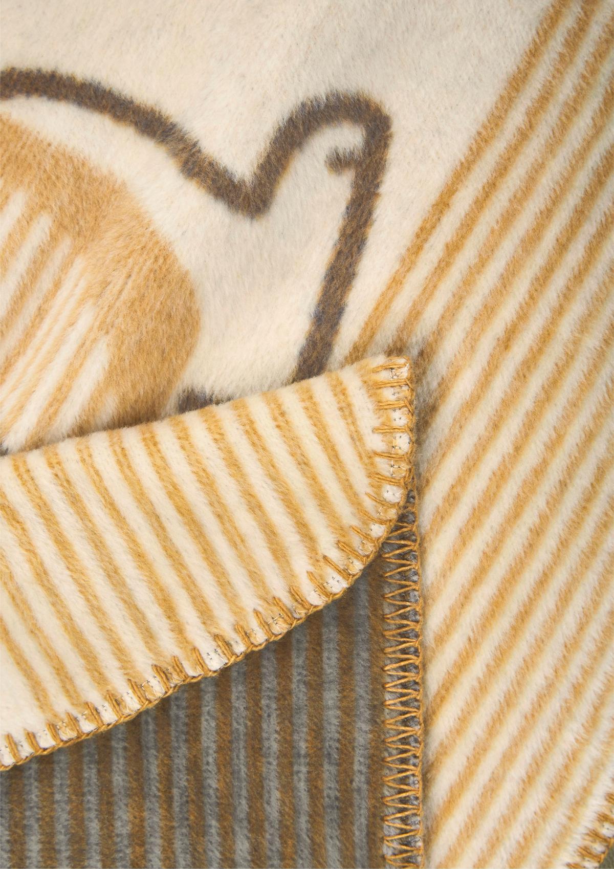 Jacquard-Decke mit Dino-Motiv - helles beige